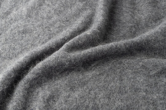 Dark grey luxury pure brushed cashmere texture as background with copy space.