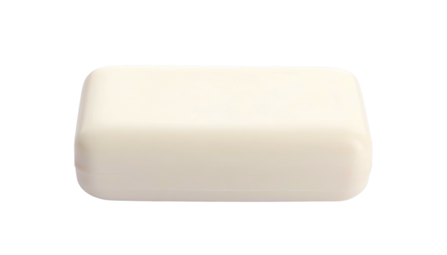 Rectangular bar of white soap, isolated against a black background, showing rounded edges
