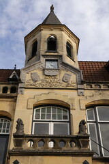 Valkenburg Clock Tower Building in Autumn: Historic Facade, Balcony, and Stone Architecture