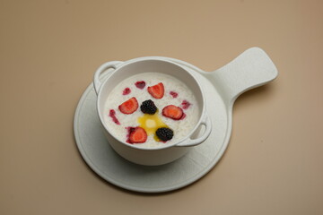 A Delicious Yogurt Bowl topped with Fresh Seasonal Fruits and