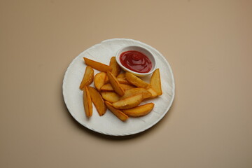 Delicious and Crunchy Potato Wedges Served with Tasty Ketchup on