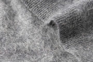 Dark grey luxury natural brushed cashmere texture. Fluffy knit background.