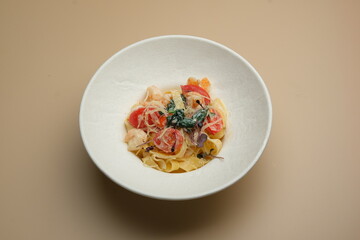 A delicious pasta dish with fresh ingredients and toppings that