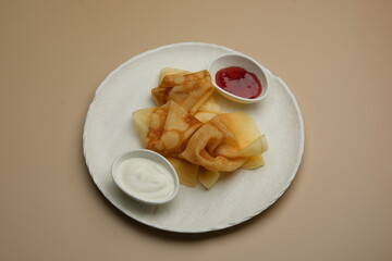 Delicious and Fluffy Pancakes Beautifully Served with Various Sauces Artfully