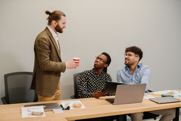 Diverse business team discussing ideas during meeting