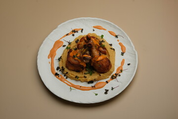 A Truly Delicious and Beautifully Plated Dish Featuring Scallops Accompanied