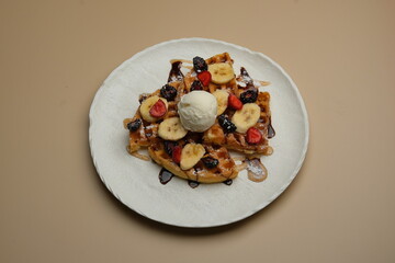 Enjoy a delicious waffle topped with creamy ice cream and