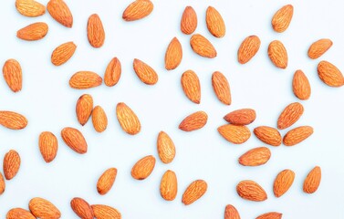 Top View of Almond Nut Scattered on Light Blue Background with Copy Space