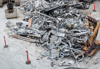 Obraz premium Aluminum industry extrusion at building construction site. Aluminum building system. Aluminum extrusion profile. Construction site storage with aluminum tubes. Steel extrusion. Industry material