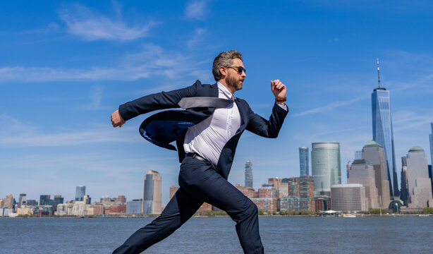 Successful deal. Business success. Successful businessman hurrying on New York city. Business man in Manhattan. Business success in big city. Businessman running to success. Business sprint skyline - Powered by Adobe