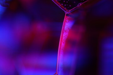 Purple liquid glowing flat film, colourful macro abstraction, interference pattern, glowing elements