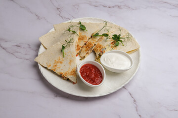Indulge in a Delicious Quesadilla that is accompanied by a