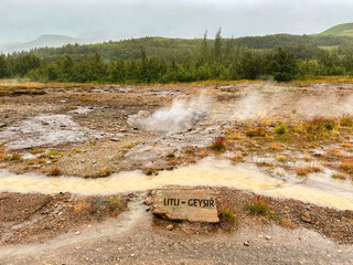 Strokkur, Iceland - 31 August 2024: Sign in front of the Little Geysir in the Geysir Hot Spring Area