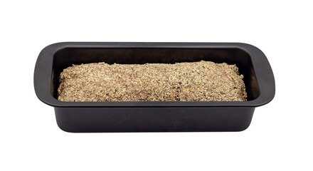 Freshly cooked pumpernickel bread still in the bread pan. The bread is made from black rice and millet. The isolation is on a transparent background in the PNG format.