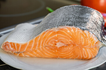 Salmon fillet on a plate in the kitchen