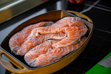 Marinated salmon steaks in a bowl