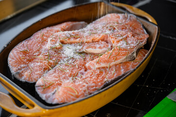 Marinated salmon steaks in a bowl