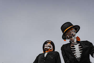 Halloween Skeletons Wearing Suits and Hats