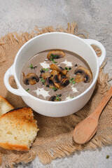 Indulge in a bowl of delicious mushroom soup topped with