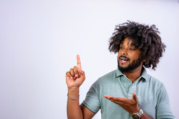 Black man pointing up showing concept space