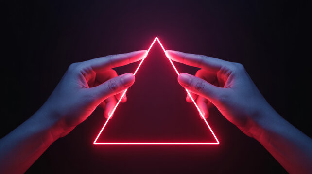Two hands delicately touching a vibrant glowing neon red triangle frame on a dark background abstract futuristic geometric shape and digital technology concept