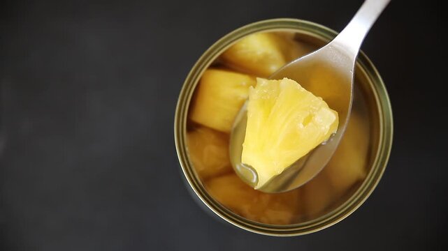Pineapple canned chunks sweet fruit dessert tasty snack fresh delicious gourmet food background on the table rustic top view copy space keto and paleo diet vegetarian and vegan food