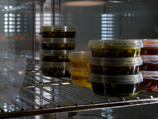Cans of pesto on display for sale