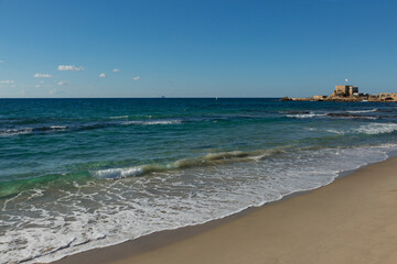 Seascape on a clear sunny day during a walk along the shore of the azure sea