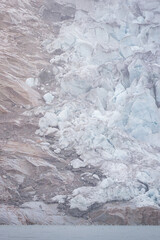 View of Islandis glacier in Qalerallit Sermia fjord, Greenland, with calving icebergs and glacier wall, August 2025