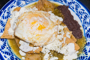 Traditional Mexican Chilaquiles with Fried Egg and Green Salsa