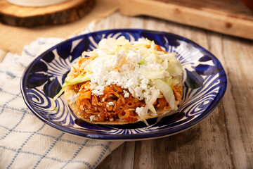 Chicken tinga toast, a traditional Mexican home-cooked dish consisting primarily of chicken cooked with chipotle chili and lots of onion, is traditionally eaten on 
