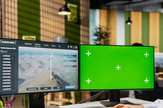 RD professional studies next generation wind turbine technologies on green screen PC to accelerate clean energy adoption. Researcher optimizes aerodynamic design of VAWT turbine using mockup computer
