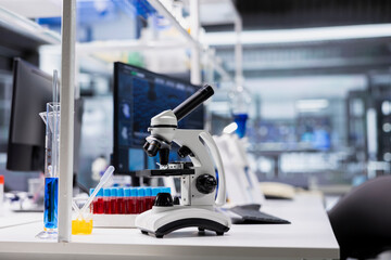 Close up of scientific microscope in medical laboratory ready to be used for cellular analysis. Optical device equipment used for sample examination inside high tech research facility