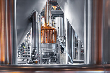 Modern brewery factory with stainless steel equipment and copper tanks