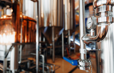 Industrial brewery factory equipment with pressure gauge and steel pipes