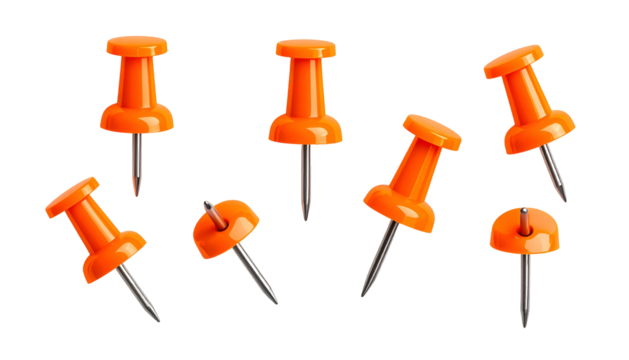 Isolated image of seven orange push pins with metallic needles against a stark black backdrop