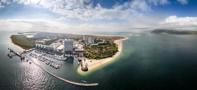 Stunning panorama of Troia Portugal showcasing the coast, marina, and lush landscape under a clear sky