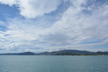 Blue sea and white clouds above it