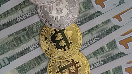 Golden Bitcoin coins on a pile of US dollar bills, symbolizing cryptocurrency and global finance. Concept of digital currency, investment, and economic growth. - Powered by Adobe