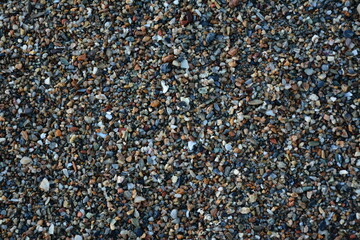 Small beautiful sea stones in the water. Background