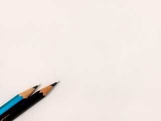 Creative concept with two pencils and ample copy space