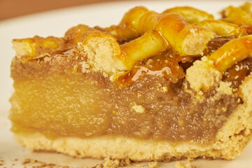 Close-up photo of an apple pie on a white background with copy space. Studio photography.