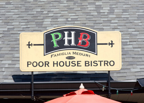 San Jose, CA - Oct 5, 2025: Close up on PHB, Poor House Bistro sign. A popular Italian Restaurant in Little Italy.