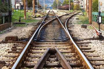 Fototapeta premium Railway junction with multiple tracks diverging, symbolizing choice, direction, and connection in transportation and travel infrastructure.