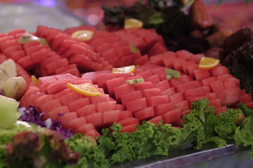 Fresh watermelon that has been sliced into several pieces is served as a dessert.
