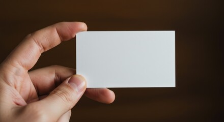 Hand Holding Blank Business Card.