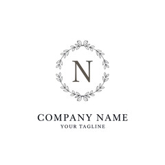 Elegant Floral Wreath Monogram with Letter N and Company Name.