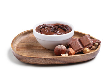 Bowl with tasty chocolate spread and hazelnuts isolated on white background, closeup