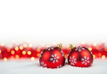 Festive Christmas ornaments with snowflake design on a snowy surface
