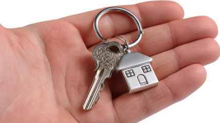 Keys to Home: A hand cradles a set of keys, the house-shaped charm gleaming, symbolizing new beginnings and the promise of a home.